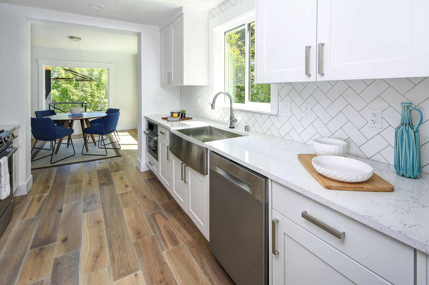 2022 11 22 kitchen galley white cabinets rustic flooring