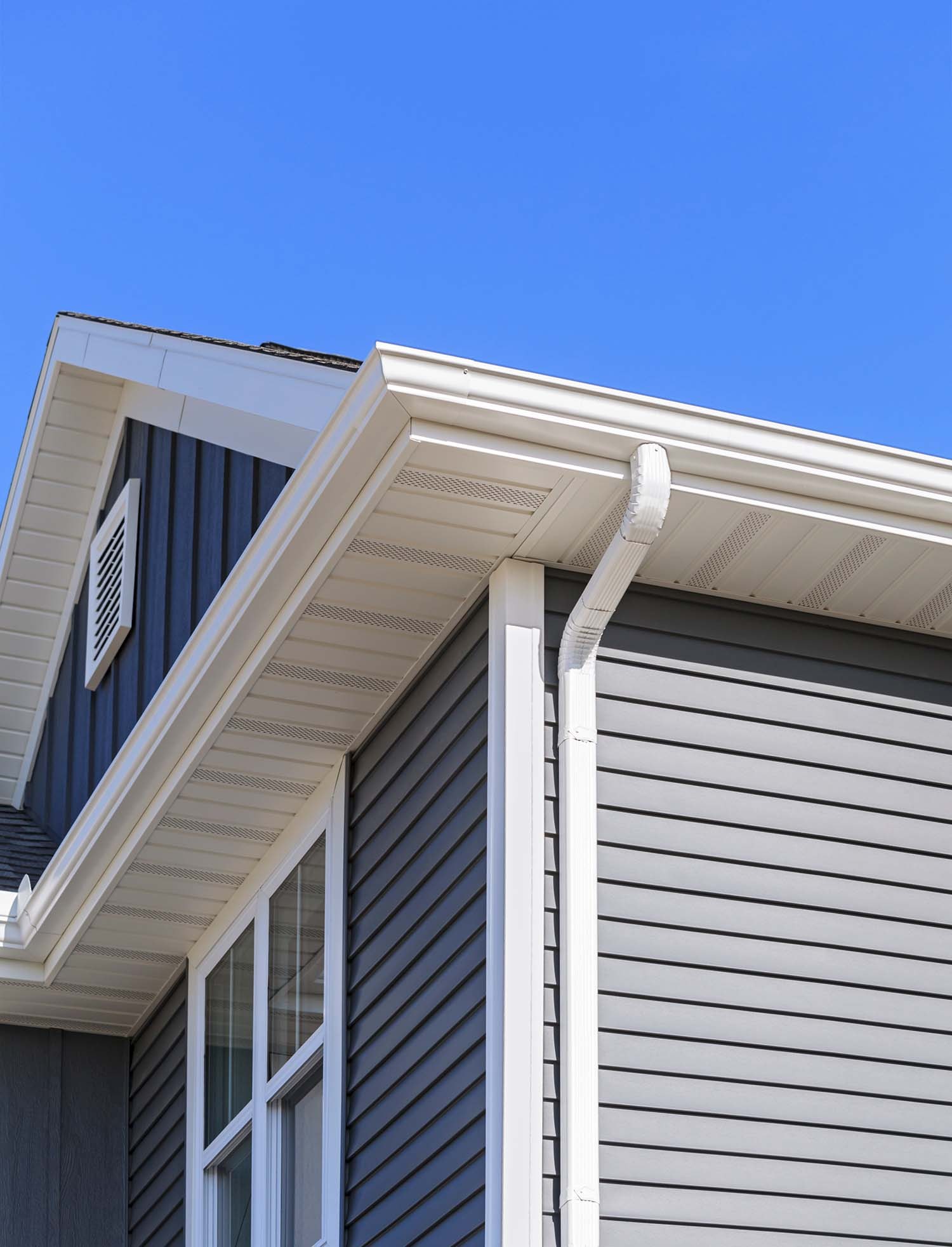 2022 12 9 gutters vinyl soffit blue siding