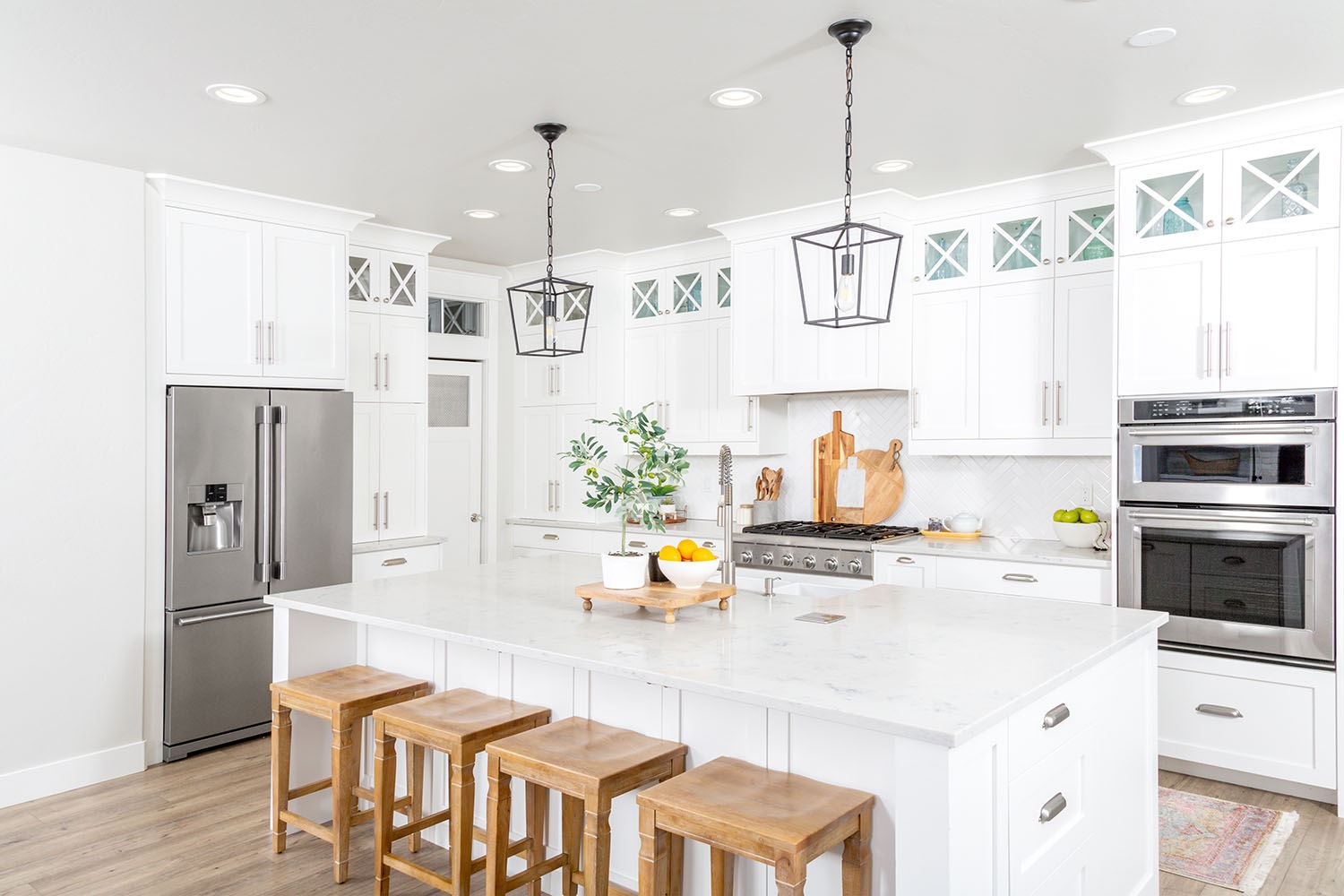 2023 01 10 white kitchen island with bar stools decorative cabinets